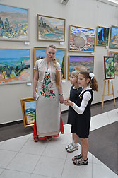 Young students with teacher of Painting and Composition at the Faculty of Fine Arts of the Kyiv Children Academy of Arts - Violetta Monsevich.
